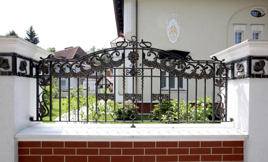 Private residence. Gates, fences, column decorations.