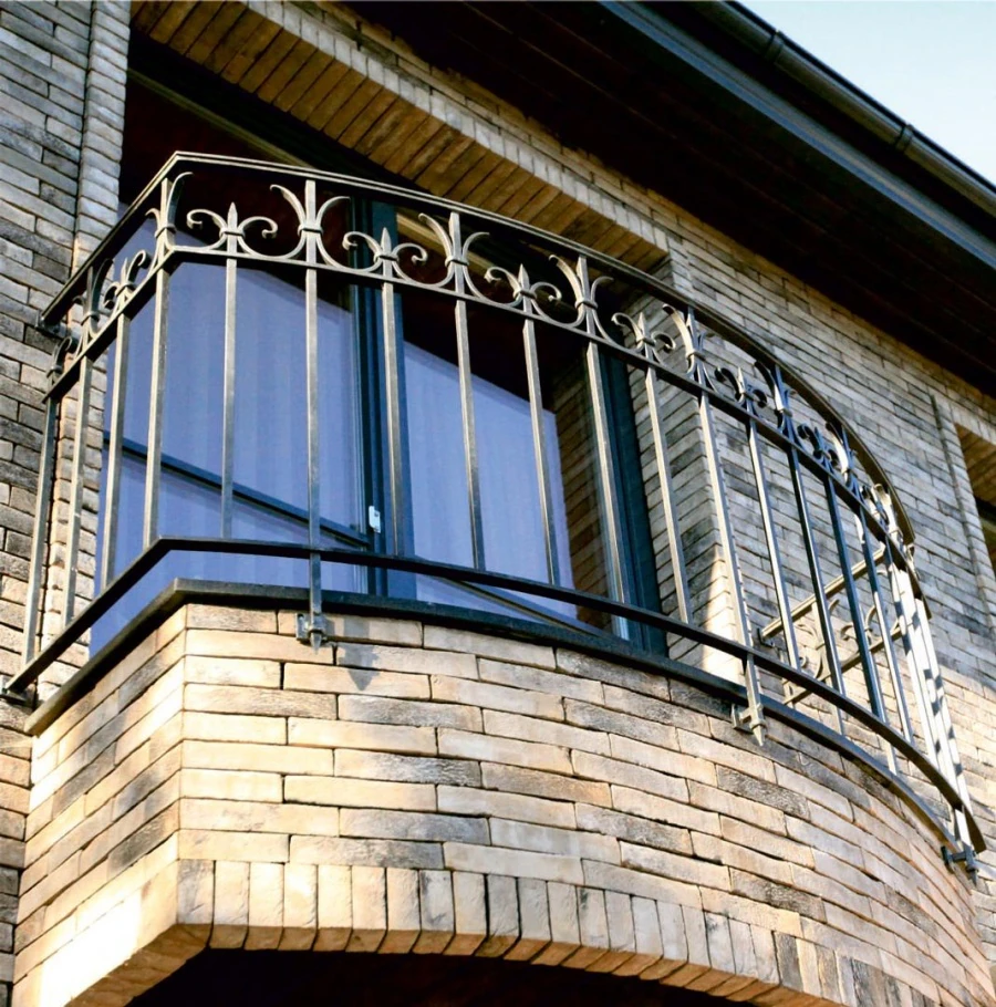 Private residence. Gates with wickets, fence, balcony railings.