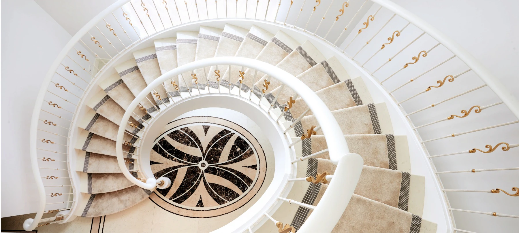 Forged steel staircase with railings and a wooden handrail