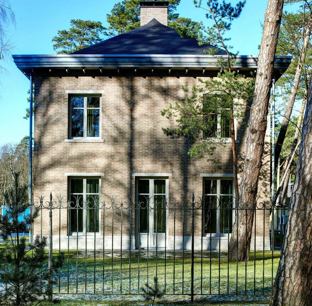 Private residence. Gates with wickets, fence, balcony railings.