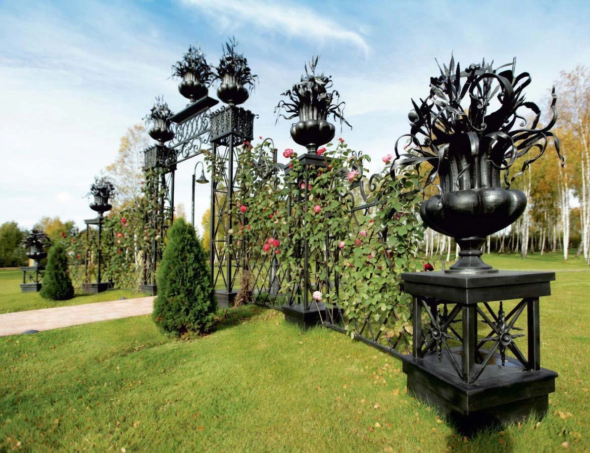 Private residence. Pergola with decorative vases.